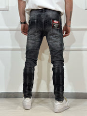 Jeans skinny denim con rotture uomo